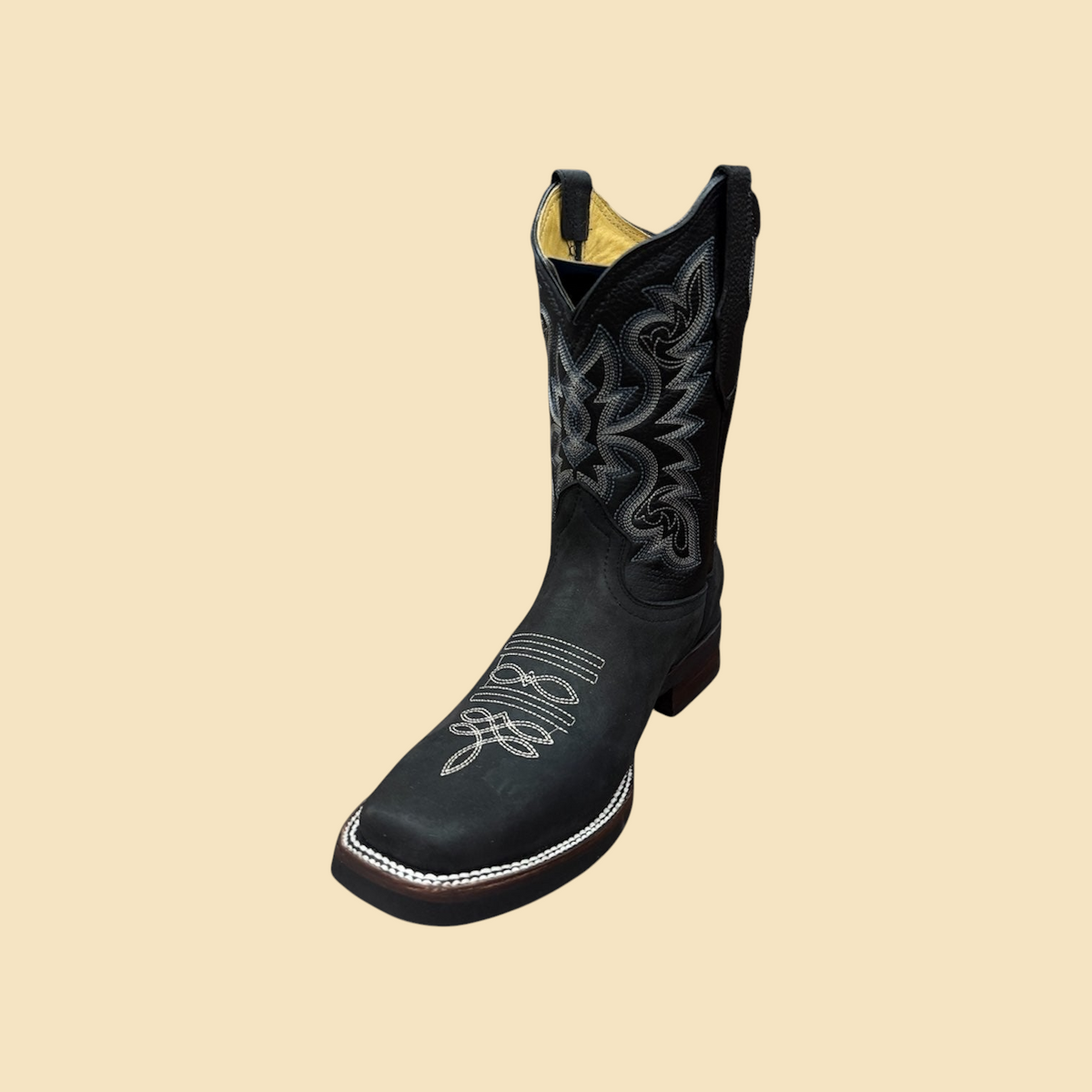 Lopez Fashion black leather cowboy boots with intricate white contrast stitching and a square toe design.