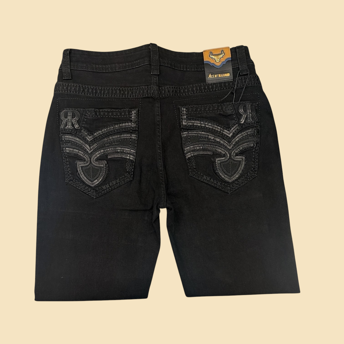 Lopez Fashion black denim jeans featuring intricate tonal embroidery on the back pockets and Ace of Diamond branding.
