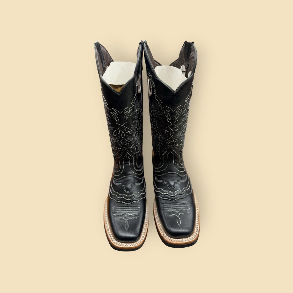 Lopez Fashion black leather cowboy boots with white contrast stitching and a square toe silhouette.