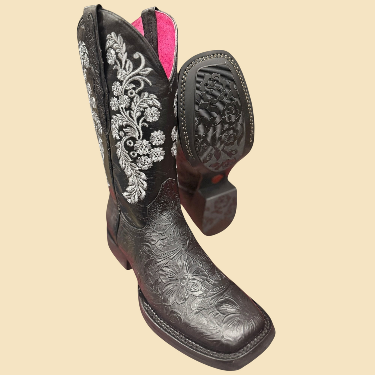 Lopez Fashion black leather cowgirl boots with floral embossing, silver embroidery, and vibrant pink interior lining.