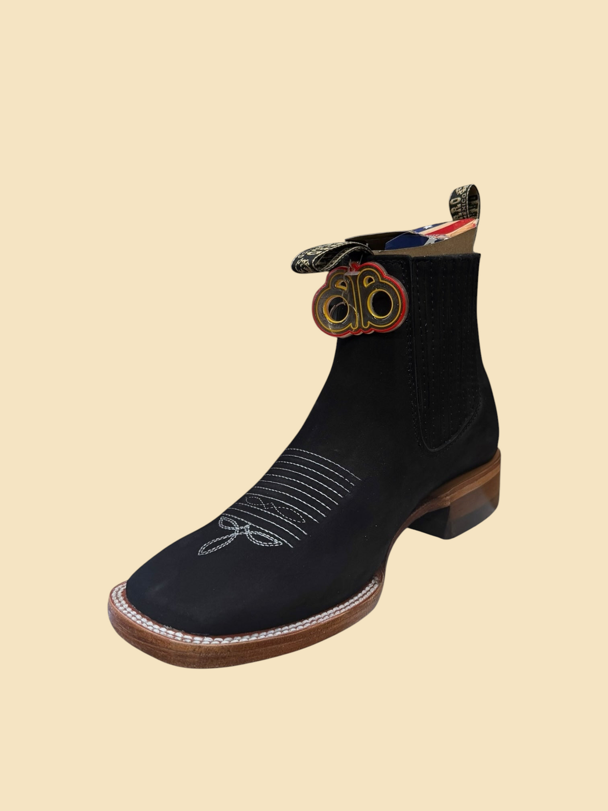 Lopez Fashion BESSERRO black leather Western Chelsea boots with square toe, white stitching, and elastic side panels.