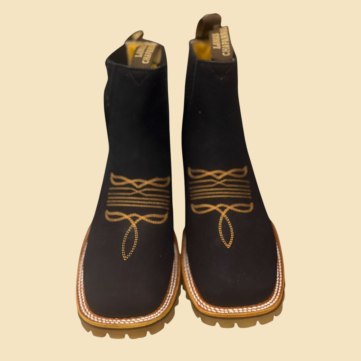 Lopez Fashion black suede western Chelsea boots with golden decorative embroidery and rugged Vibram lug soles.
