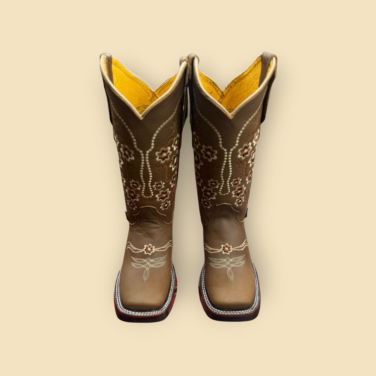 Lopez Fashion brown leather cowgirl boots with intricate floral embroidery, square toes, and yellow interior lining.