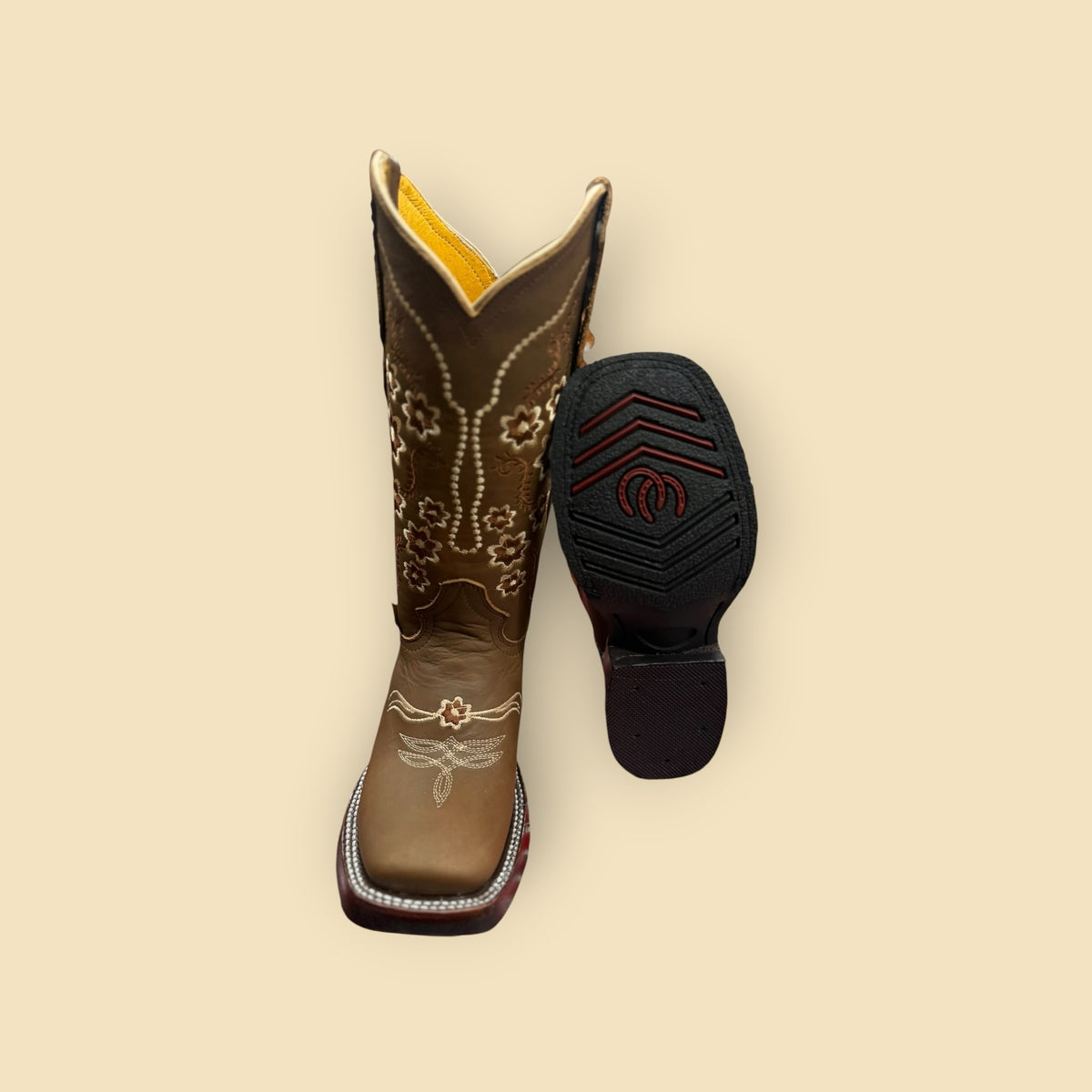 Lopez Fashion brown leather cowgirl boots with floral embroidery, square toe, and yellow lining, showing sole tread.