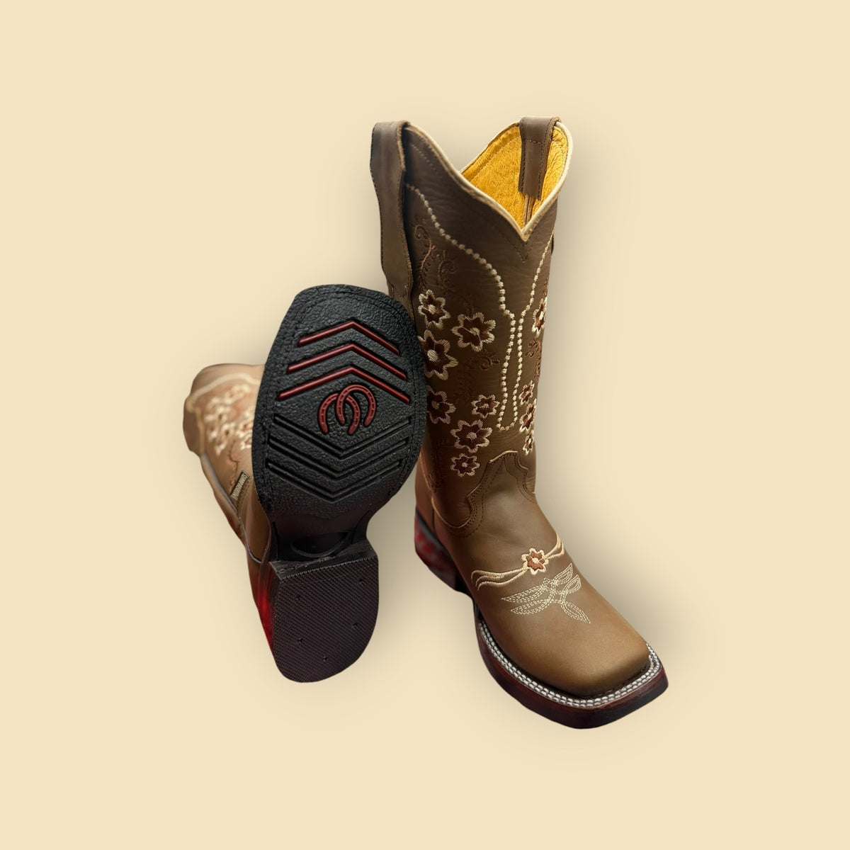 Lopez Fashion brown leather cowgirl boots with floral embroidery, square toe, and yellow lining, showing rubber sole.