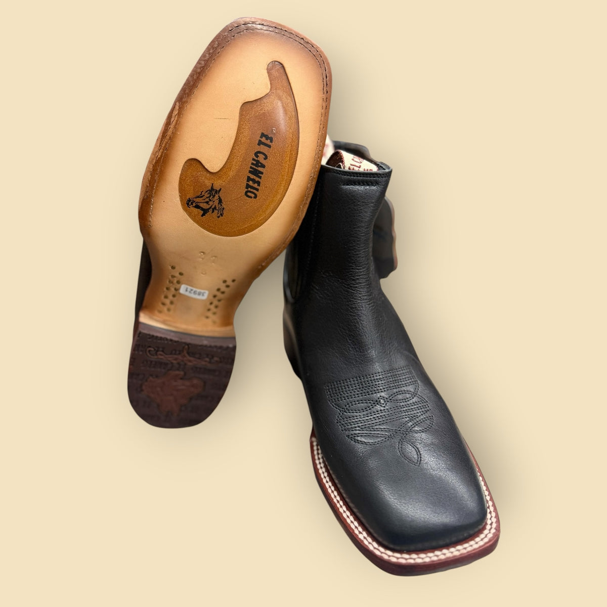 Lopez Fashion EL CANELO black leather square-toe Western boots showing the detailed branded sole and vamp stitching.