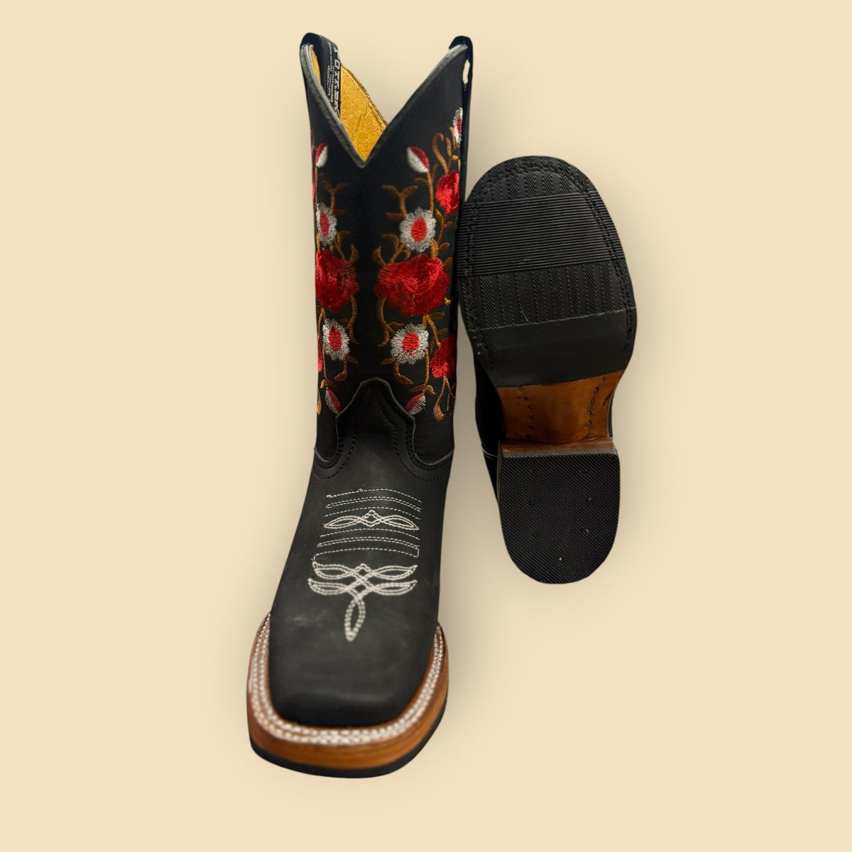Lopez Fashion black leather cowboy boots with vibrant red and white floral embroidery and a classic square-toe design.