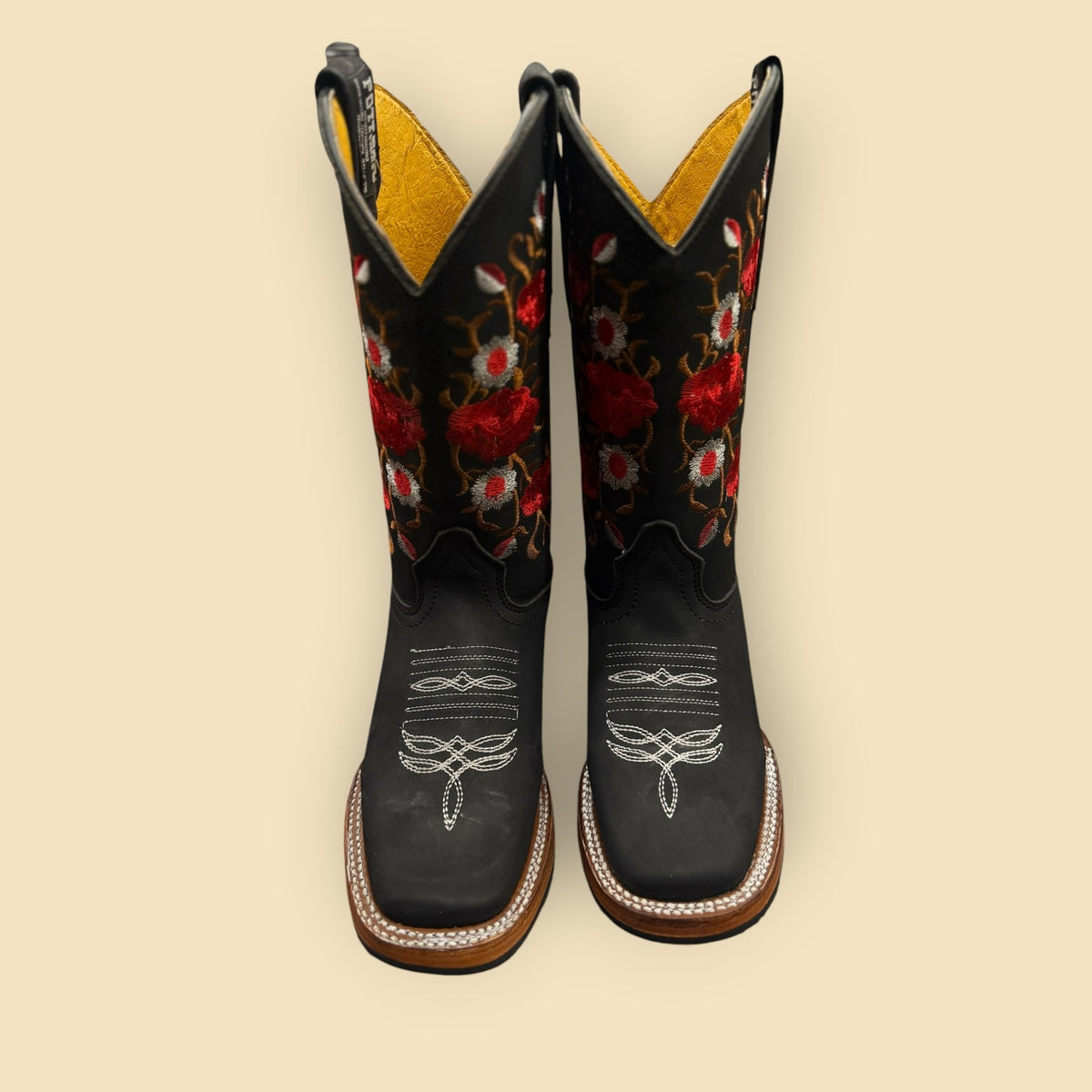 Lopez Fashion black leather cowboy boots with vibrant red and white floral embroidery and a square-toe design.