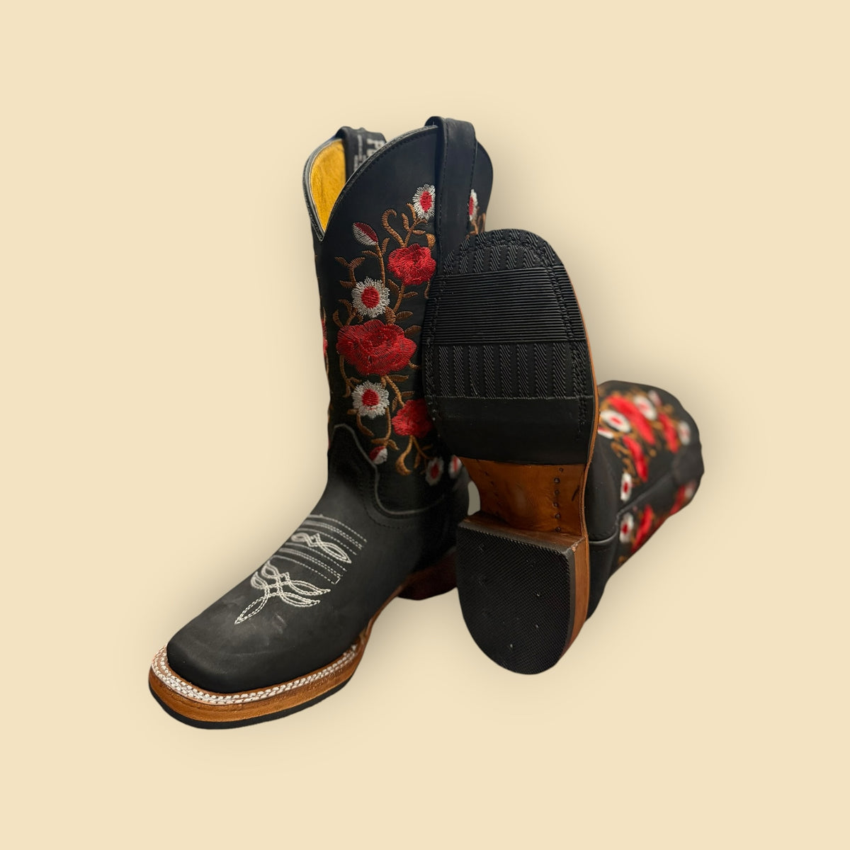 Lopez Fashion black leather cowgirl boots featuring vibrant red and white floral embroidery and a square-toe design.
