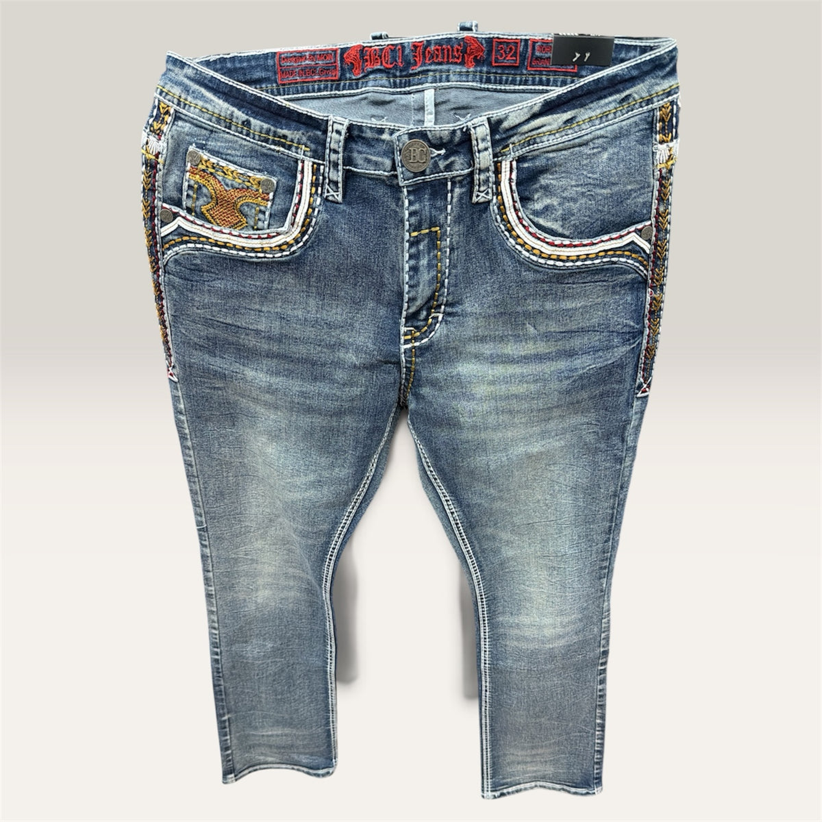 Lopez Fashion medium-wash denim jeans featuring intricate multi-colored embroidery on the front pockets and side seams