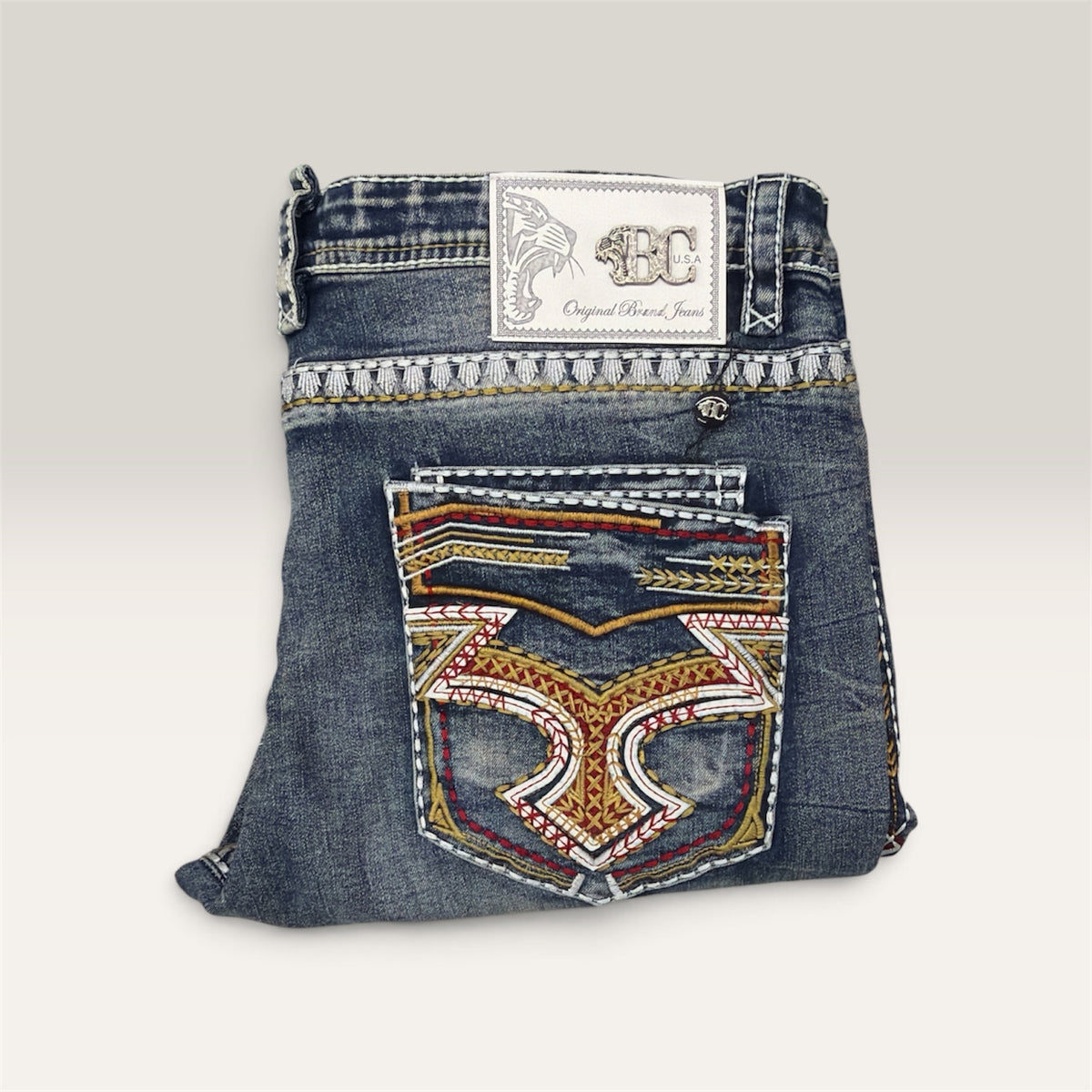 Lopez Fashion medium-wash denim jeans featuring intricate multi-colored embroidery on the back pocket and waistband.