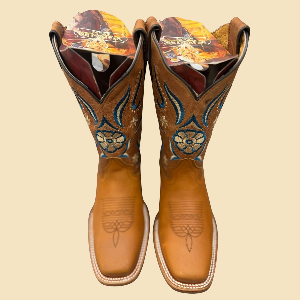 Lopez Fashion tan leather Western square toe boots with blue and cream floral embroidery on the shaft